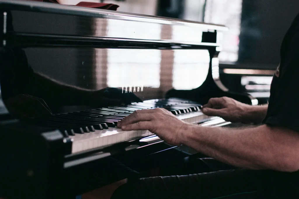 A photo of someone playing a Yamaha piano