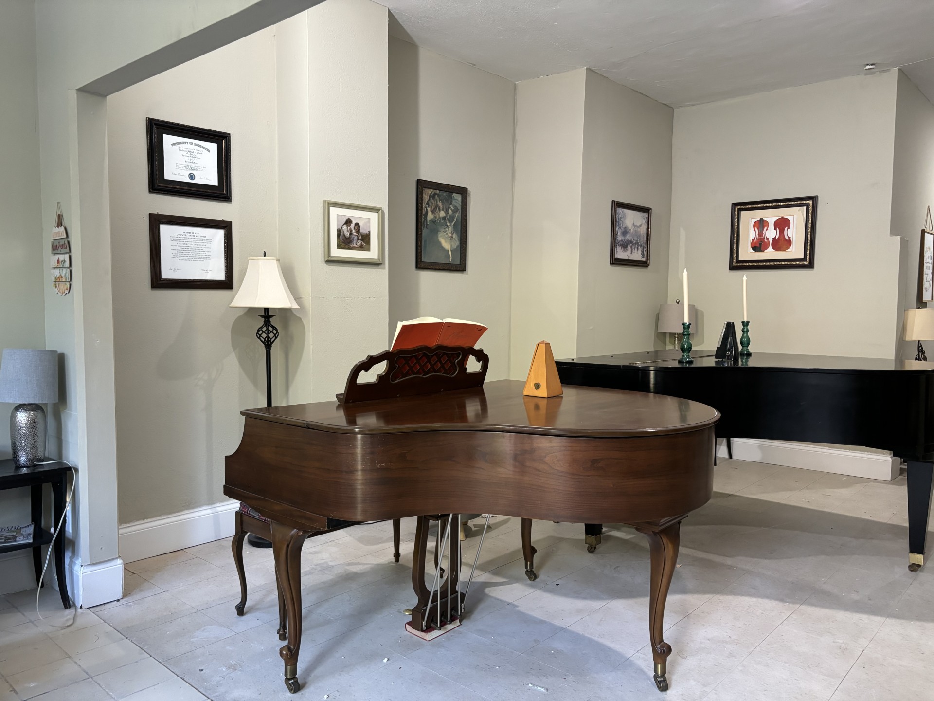 Inside of Music Corner STL's studio on West Pine Blvd in St. Louis, MO are two grand pianos